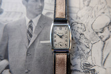 Load image into Gallery viewer, Vintage wristwatch with brown leather strap on a textured background